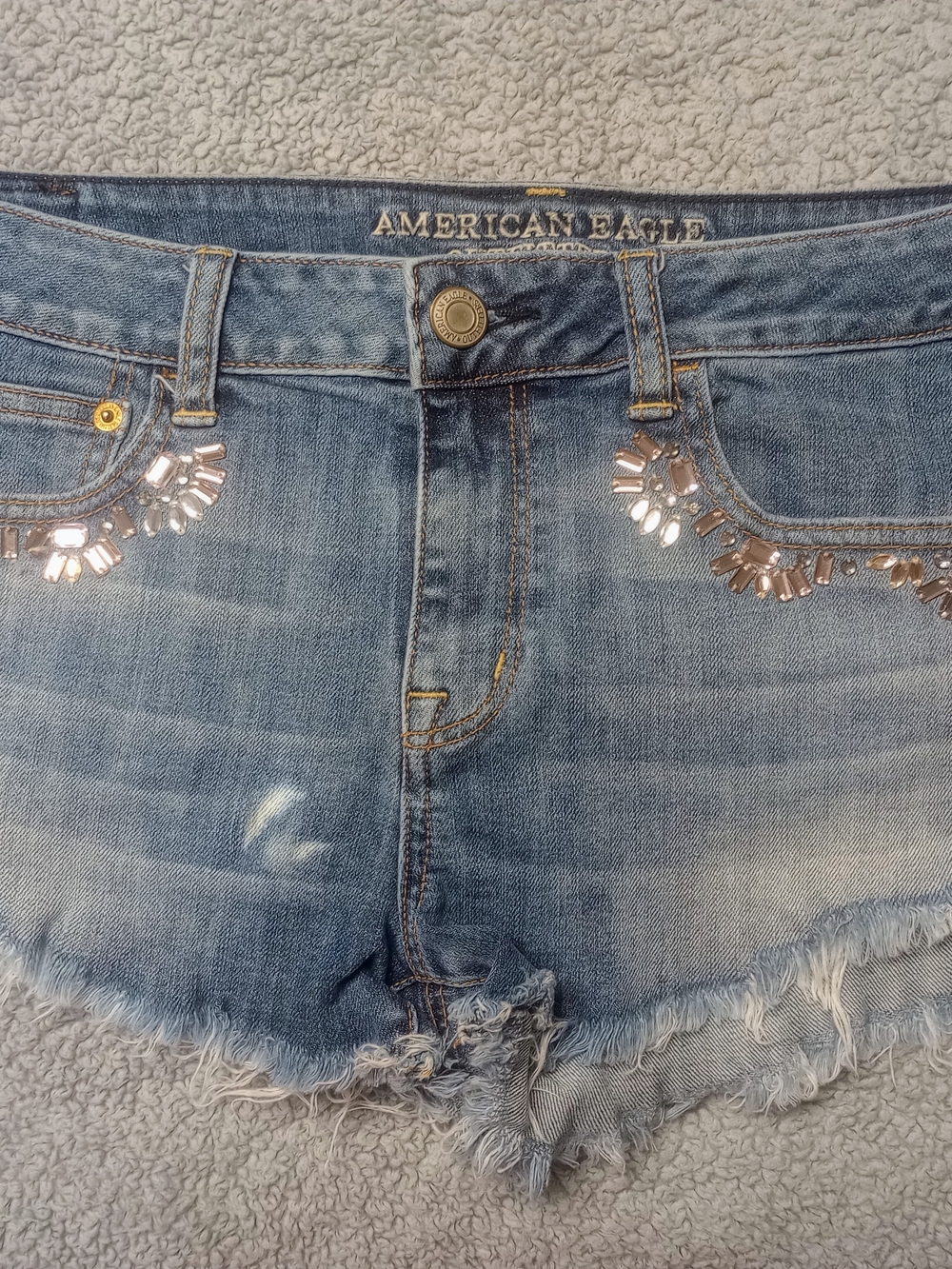 American Eagle Light Wash Denim Cutoff Shorts with Embellished Pockets